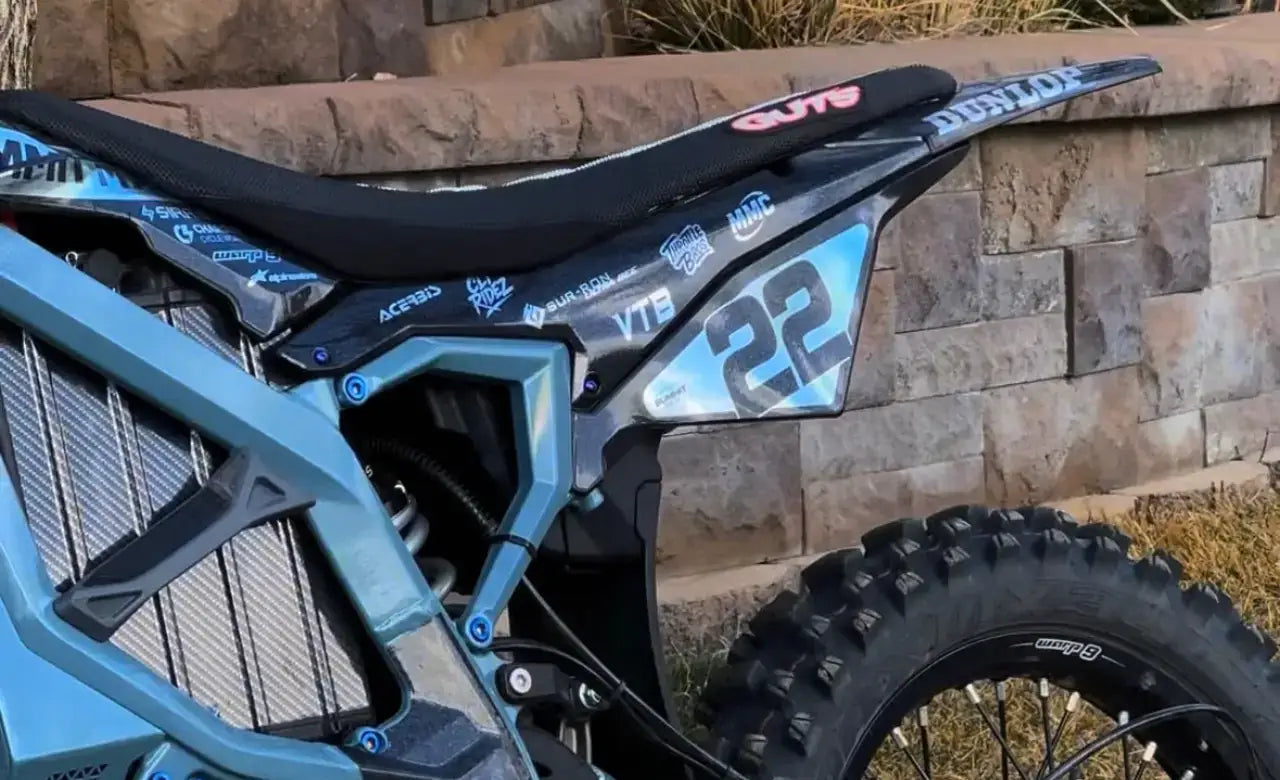 Blue Sur-Ron Ultra Bee with number 22 graphics