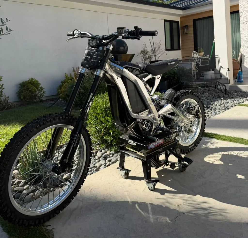 Polished Sur-Ron Light Bee X on a bike stand