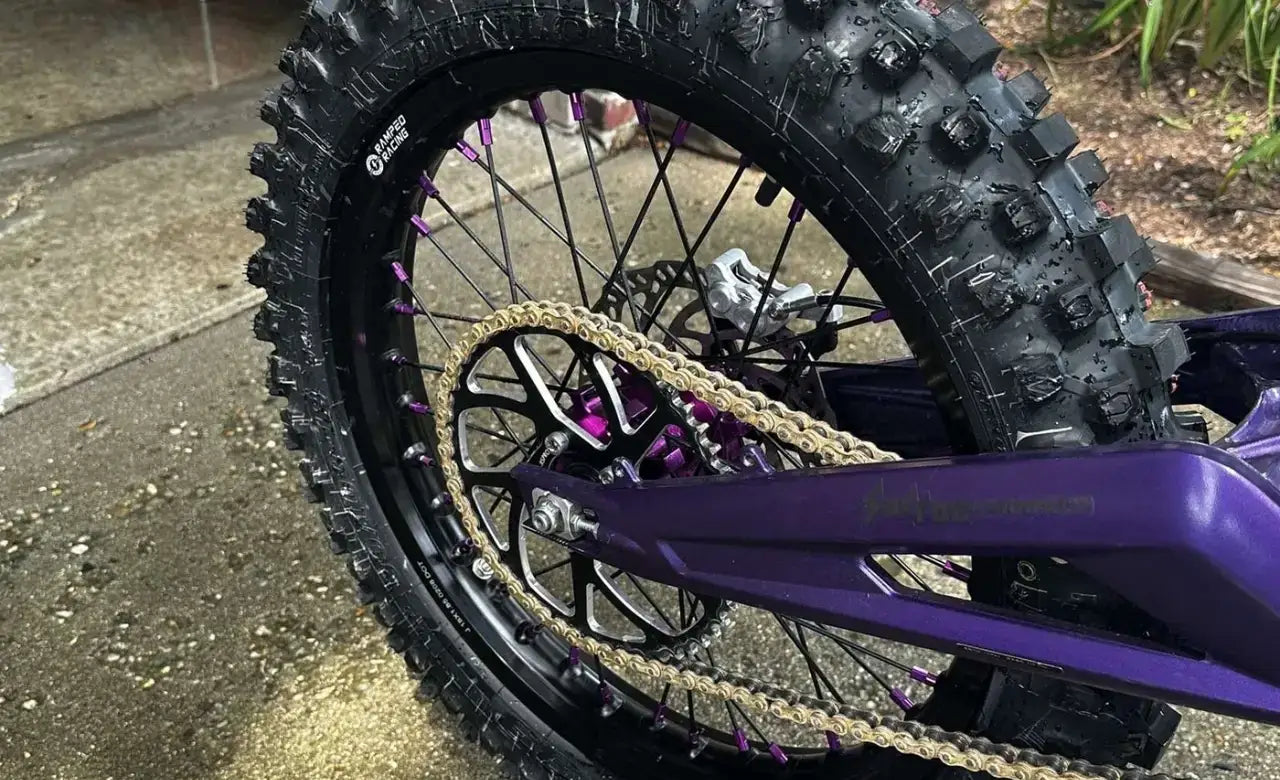Close-up of a laced 18 inch wheel with dirt tire