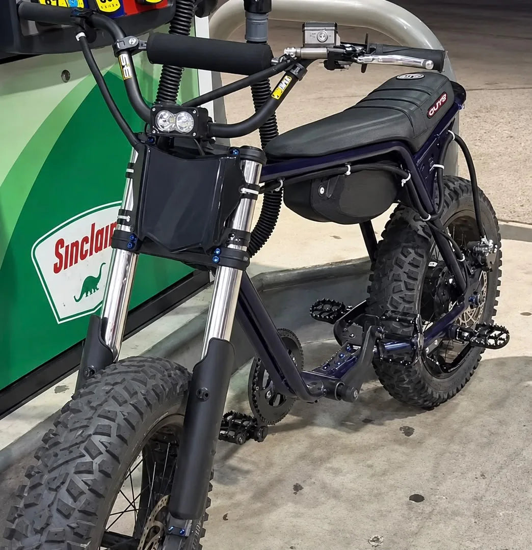 Blacked-out e-bike build with moto fork and Baja-style light