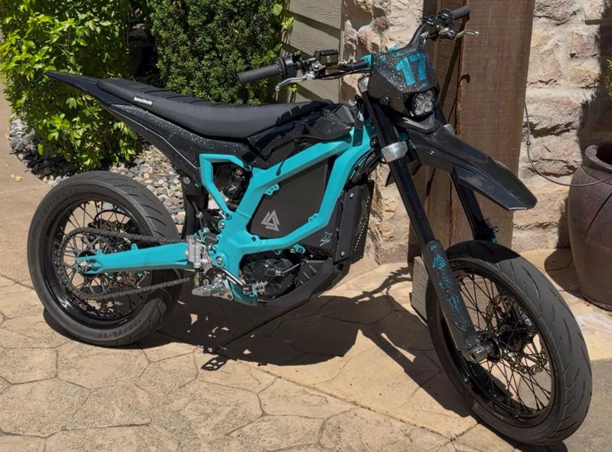 Teal Sur-Ron Light Bee X supermoto with number 17 plate